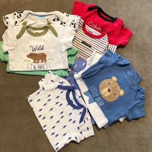 Never worn set of 10 one pieces